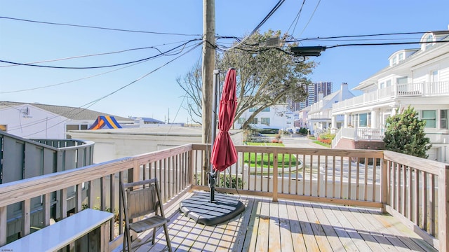 wooden terrace with a residential view