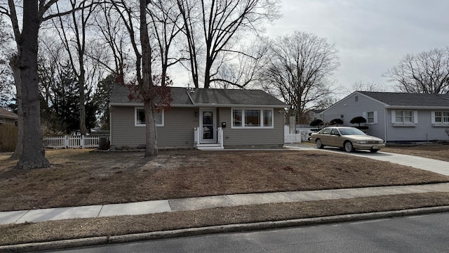 ranch-style house with fence