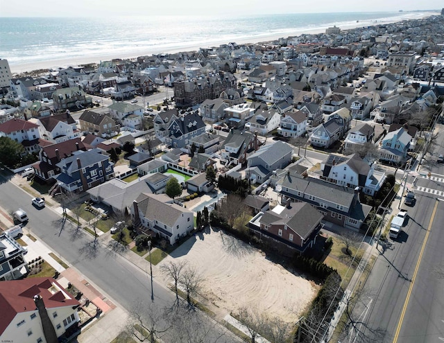 bird's eye view with a residential view and a water view