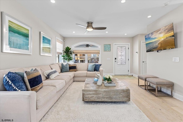 living room featuring a ceiling fan, wood finished floors, recessed lighting, and baseboards