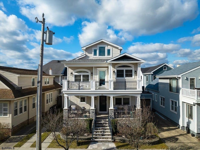 view of front of property featuring a porch and stairs