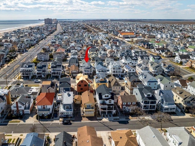 bird's eye view featuring a residential view and a water view