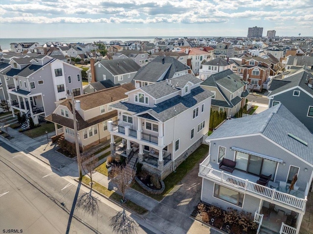 birds eye view of property with a residential view