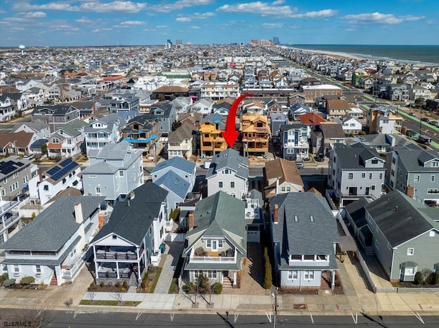 bird's eye view with a residential view and a water view