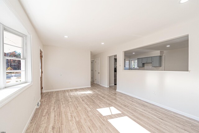 empty room with recessed lighting, visible vents, baseboards, and light wood-style flooring