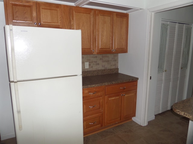 78 Tyler Rd, Greenfield, NJ 08230 - kitchen featuring tasteful backsplash, brown cabinetry, and freestanding refrigerator