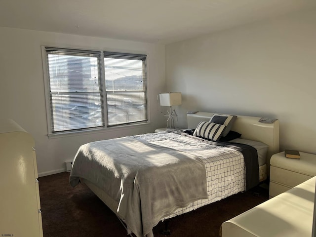 bedroom with carpet flooring and baseboards