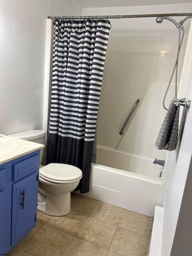 full bath featuring tile patterned floors, toilet, shower / bath combo, and vanity