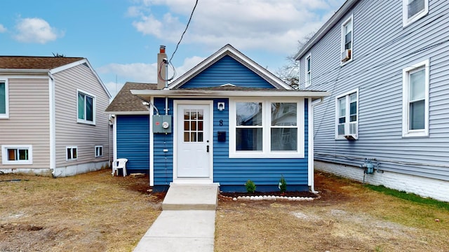 view of front of home featuring a shingled roof