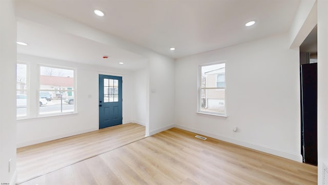 entrance foyer with visible vents, light wood-style flooring, recessed lighting, and baseboards