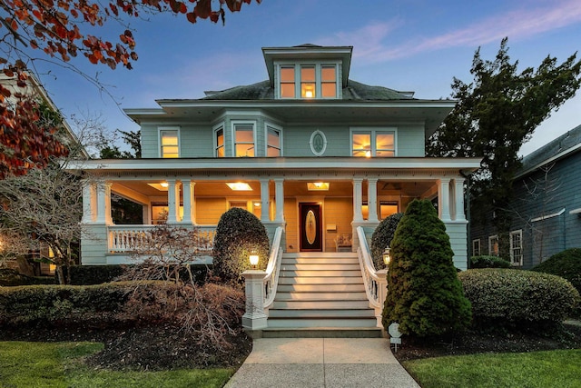 traditional style home with covered porch and stairs