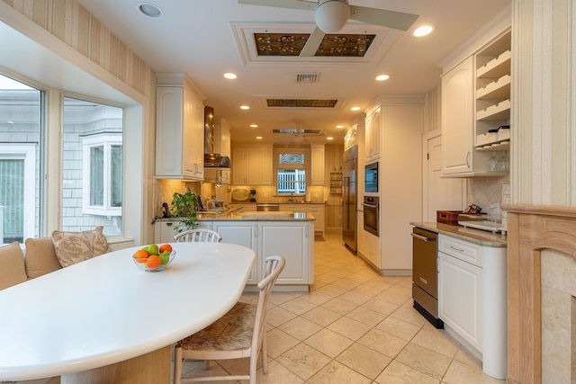 kitchen with visible vents, recessed lighting, wall oven, wall chimney exhaust hood, and backsplash