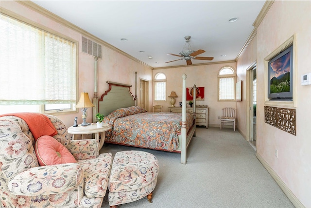 carpeted bedroom featuring visible vents, multiple windows, and crown molding