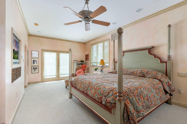 carpeted bedroom featuring baseboards, ornamental molding, and a ceiling fan