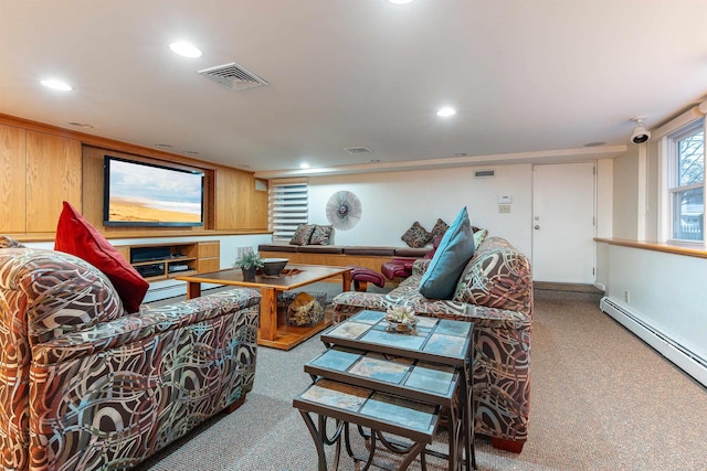 carpeted living area featuring recessed lighting, visible vents, and a baseboard heating unit