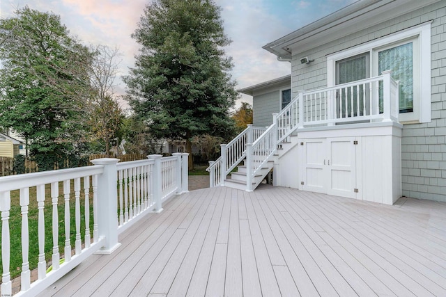 wooden deck featuring stairway and fence