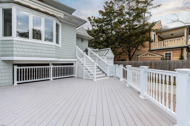 wooden terrace featuring fence