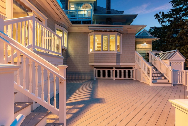 wooden deck featuring stairway