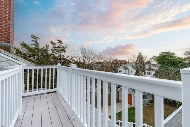 deck at dusk with a residential view