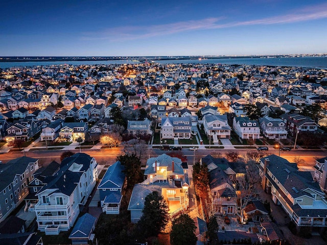 bird's eye view featuring a residential view and a water view