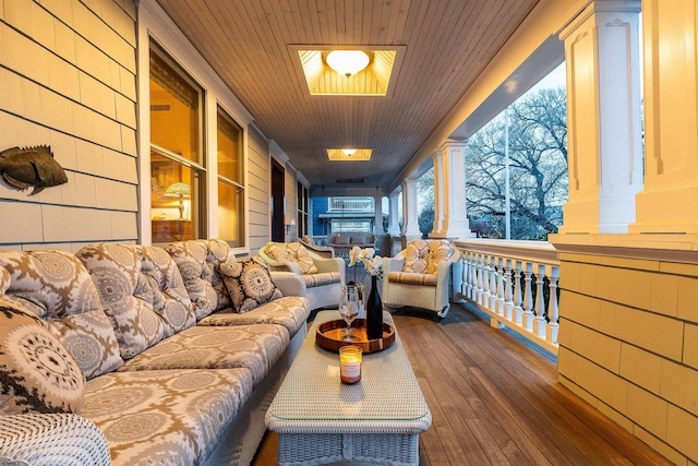 living area with dark wood finished floors and wooden ceiling