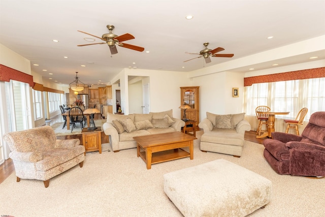 living area featuring recessed lighting and a ceiling fan