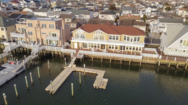 bird's eye view featuring a residential view and a water view