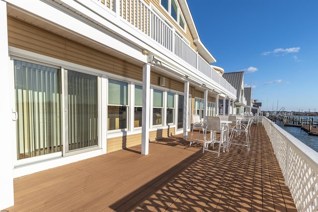 wooden deck with a water view