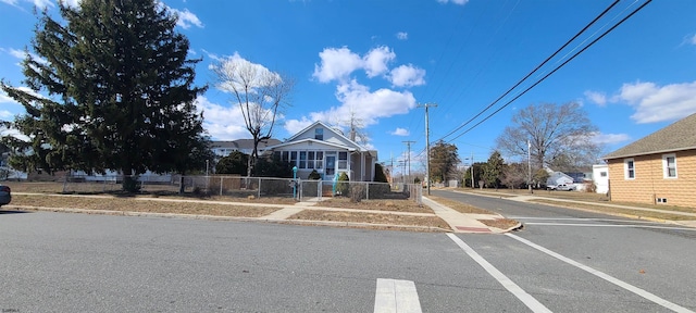 view of road with curbs and sidewalks