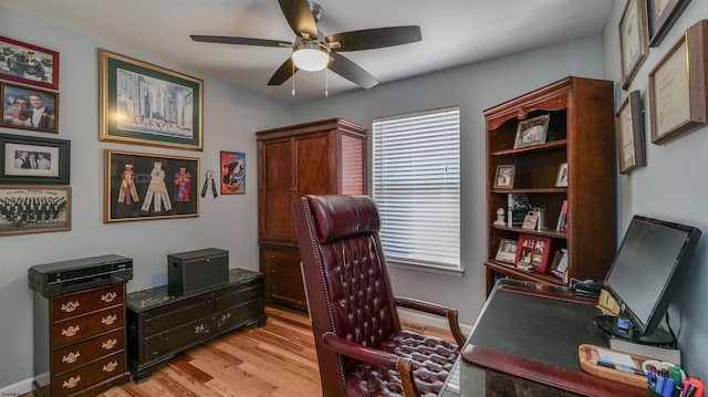 office featuring light wood finished floors and ceiling fan