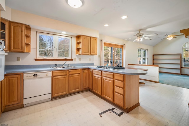 kitchen with open shelves, light floors, dishwasher, and a sink