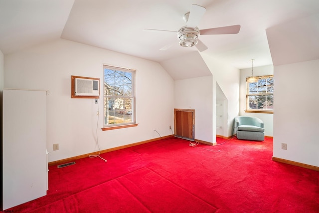 additional living space featuring a wealth of natural light, visible vents, and lofted ceiling