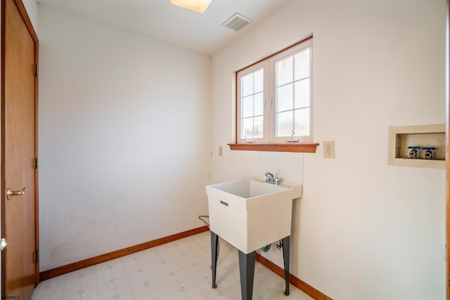 clothes washing area with visible vents, baseboards, light floors, laundry area, and hookup for a washing machine