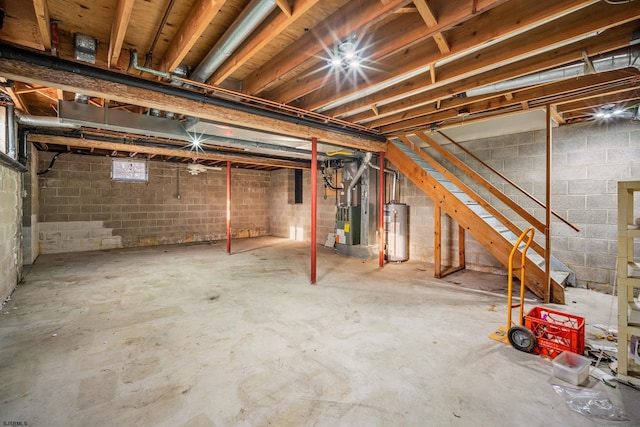 unfinished below grade area featuring gas water heater, stairway, and heating unit