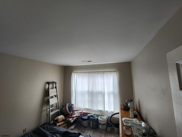 bedroom with wood finished floors