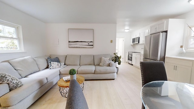 living area featuring light wood-style flooring