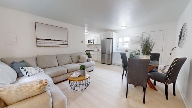 living area with light wood-style floors