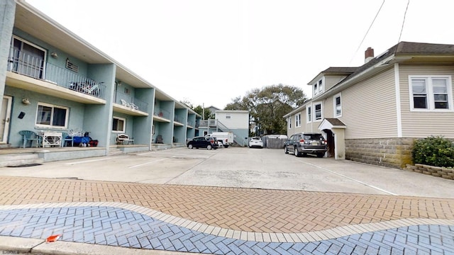 uncovered parking lot with a residential view