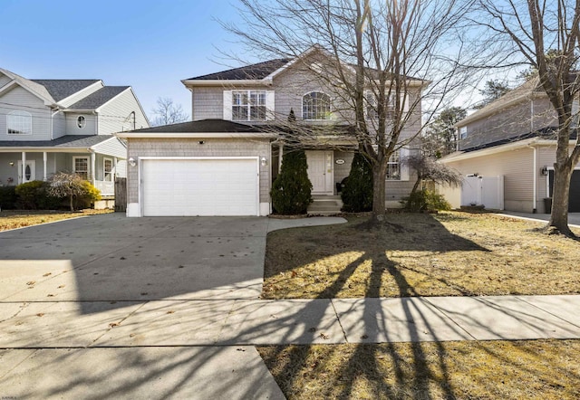 traditional home with driveway and an attached garage