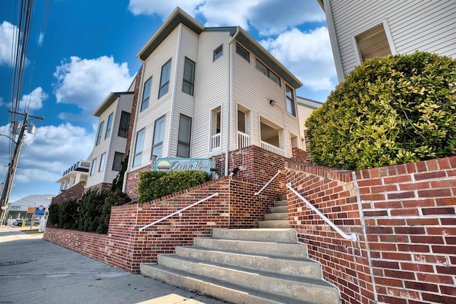 view of building exterior featuring stairs