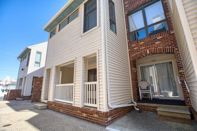 view of home's exterior featuring covered porch