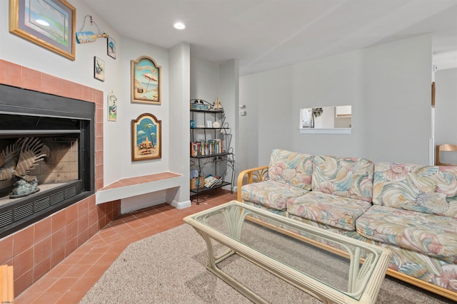 living area featuring tile patterned floors, recessed lighting, and a fireplace