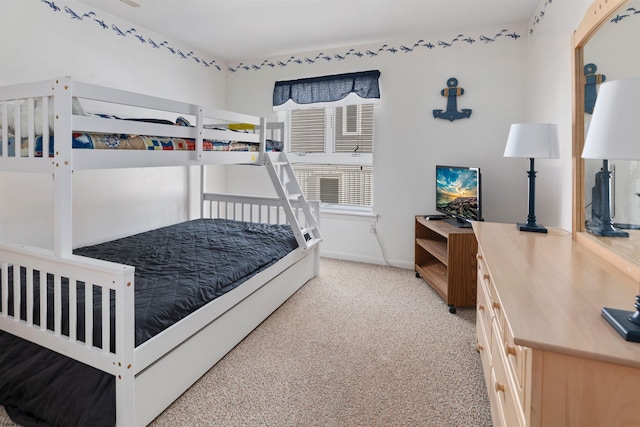 carpeted bedroom with baseboards