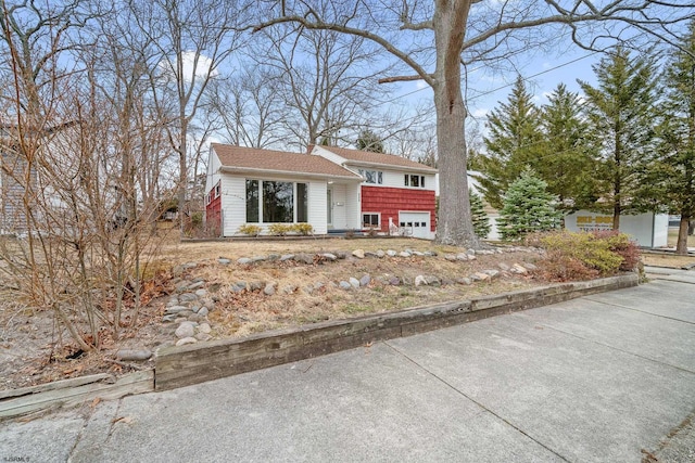 split level home with a garage