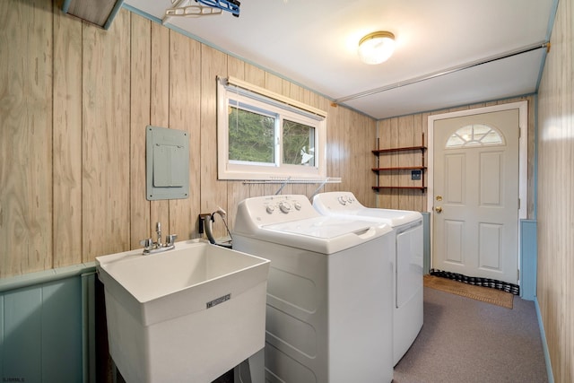 laundry area featuring laundry area, independent washer and dryer, carpet floors, and a sink