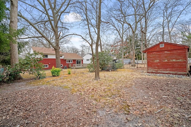 view of yard with a storage shed and an outdoor structure