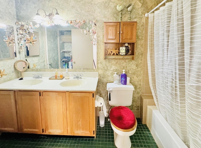 bathroom featuring a sink, toilet, shower / tub combo, and wallpapered walls