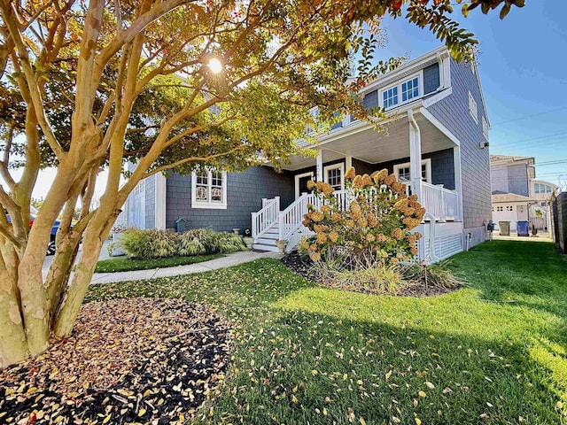 view of front of home featuring a porch and a front lawn