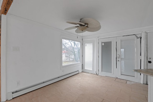 unfurnished sunroom featuring baseboard heating and ceiling fan