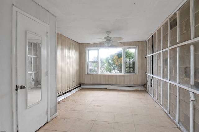 unfurnished sunroom featuring ceiling fan